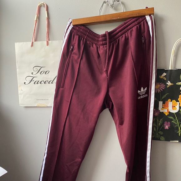 adidas sst track pants maroon